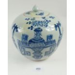 A Chinese Republic period green glazed pottery ginger jar and lid with blue painted garden scene