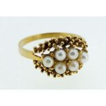 An 18 carat gold and pearl set ring, size M/N