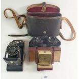 A Kodak Anastigmat camera, Ross binoculars, cased and a Swiza alarm clock