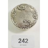 An early 20thC silver snuff box with repousse decoration and engraved monogram, 4.8cm wide, 30g.