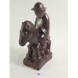 A pottery figure of a soldier on horse back by Karls Ruhe-Baden, designed by Ludwig Konig, damaged