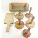 A wooden tray with pastry mould and butter presses