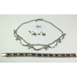 A silver early 20th century sapphire and paste bracelet, a paste necklace and a pair of paste