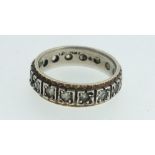 A 9ct gold and silver eternity band set with white stones. Size O.