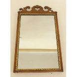 An 18th century mahogany mirror with scrollwork top, 47cm wide