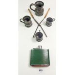 Four pewter measures, a pair of curling tongs by R Timmins and a spirit flask