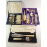 A pair of Victorian silver plated fish servers cased and a set of silver plated fish cutlery