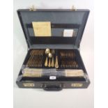 An SBS German gold plated cutlery set for ten in travel cutlery case.