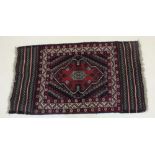 A full pile and part kelim Afghan Belouch nomadic rug, 150 x 81 cm