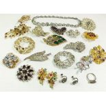 A collection of vintage costume brooches etc