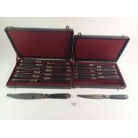 A set of French ebony and white metal mounted knives comprising twelve dinner knives and ten side