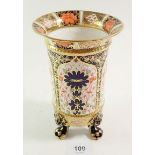 A Royal Crown Derby Imari vase on paw feet, 16.5 cm pattern No - 1128