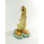 A mid 20thC figure of a yellow duck, possibly Beswick or Sylvac. Model number 317 stamped to base.