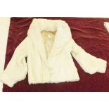 A 1940's white fur evening jacket