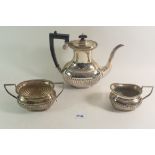 A three piece silver plated tea service with half gadrooned decoration