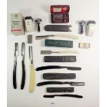 A collection of cut throat razors and other razors
