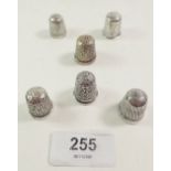 Six various silver thimbles