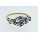 A 9 carat gold ring set six pear cut tanzanites, size N