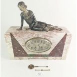 A 1920's Art Deco marble mantel clock set with spelter figure of a period lady lounging with
