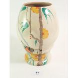 A 1950's Clarice Cliff vase painted orange flowers and cottage, 21cm tall