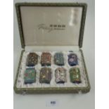 A collection of eight miniature Chinese cloisonne enamel boxes cased