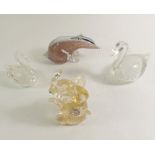 A selection of four glass animal paperweights to include a Murano elephant and others.
