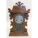 An oak American shelf clock