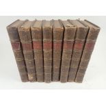A set of eight copies of The Spectator, published London 1744, leather bound