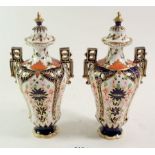 A Royal Crown Derby Imari pair of vases and lids, 19 cm