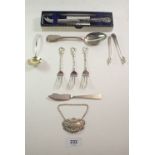 A group of silver items to include sifter spoon, Hong Kong cake forks, Whisky decanter label and a