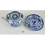 A 19th century Chinese blue and white teapot painted clouds and symbols, 10cm with metal handle