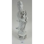 A Chinese blanc de chine figure of a woman, 35 cm tall