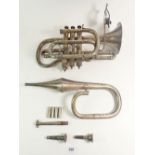A late 19thC silver plated cornet with attached lyre form music holder, possibly by Boosey & Co.