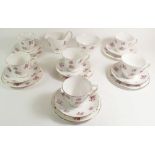A Queen Anne vintage tea service comprising: six cups and saucers, six tea plates, jug and sugar