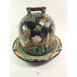 A Victorian Majolica George Jones cheese dish and cover, decorated 'Daisy and Fence' pattern on a