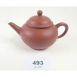 A Chinese mid to late 20thC miniature Yixing teapot, with Zhong Guo Yixing mark. 6.5 cm tall.