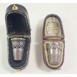 A Victorian decorative silver plated thimble engraved 'Nelly' cased and a modern silver thimble with