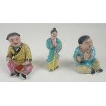 A set of three early to mid 20thC Chinese porcelain figurines depicting children, largest 11cm.