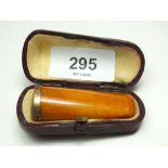 A gold mounted amber cheroot holder, cased