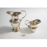 A silver cream jug, Chester 1911, 49g and a smaller one 1910, 32g