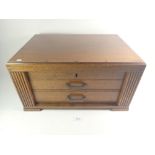 An oak canteen for cutlery with hinged lid and two drawers