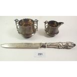 A silver cream jug and sugar bowl, Birmingham 1894, 146 gm, and a silver cake knife, Sheffield 1912
