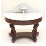 A Victorian marble topped mahogany finish console table