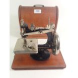 A LEAD sewing machine, cased