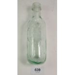 A 19th century glass round bottomed mineral water bottle moulded 'Talbot & Co' Gloucester