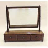 A 19th century mahogany swing mirror with three drawer box base