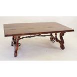 A large good quality mahogany coffee table on scroll legs united by metal stretcher 132 x 75cm