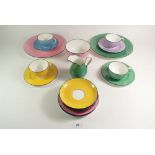 A Minton harlequin part tea service comprising: four cups and saucers, five tea plates, two cake