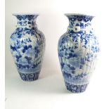 A pair 19thC or earlier Chinese vases blue and white porcelain vases with ribbed form and underglaze