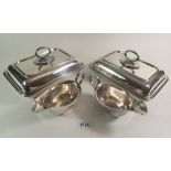 Two silver plated entree dishes and two sauce boats